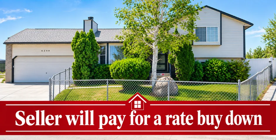 Two-story exterior with a two-car garage, partial chain-link fencing, and mature landscaping