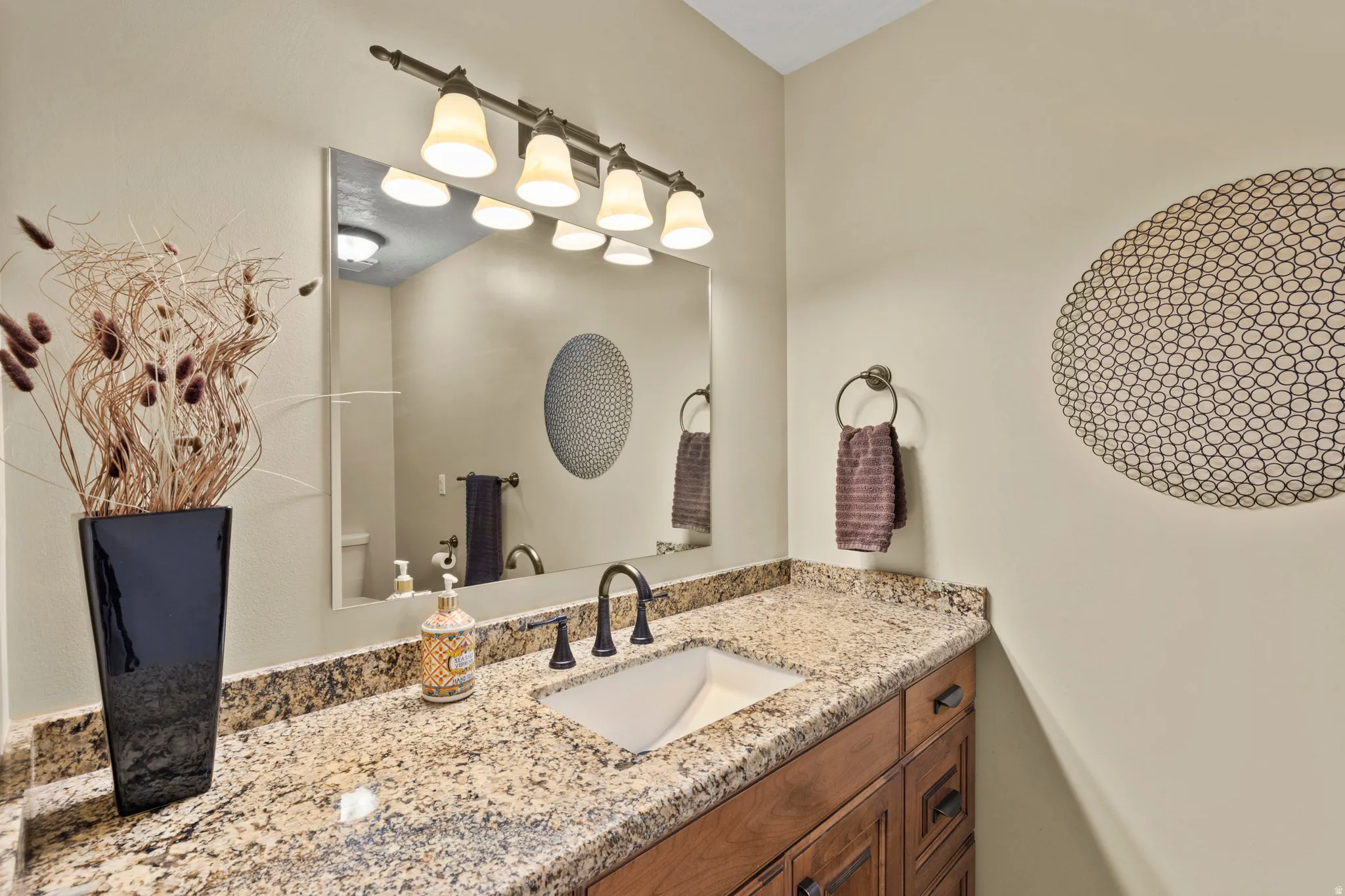 Granite countertop with an undermount sink and oil-rubbed bronze faucet