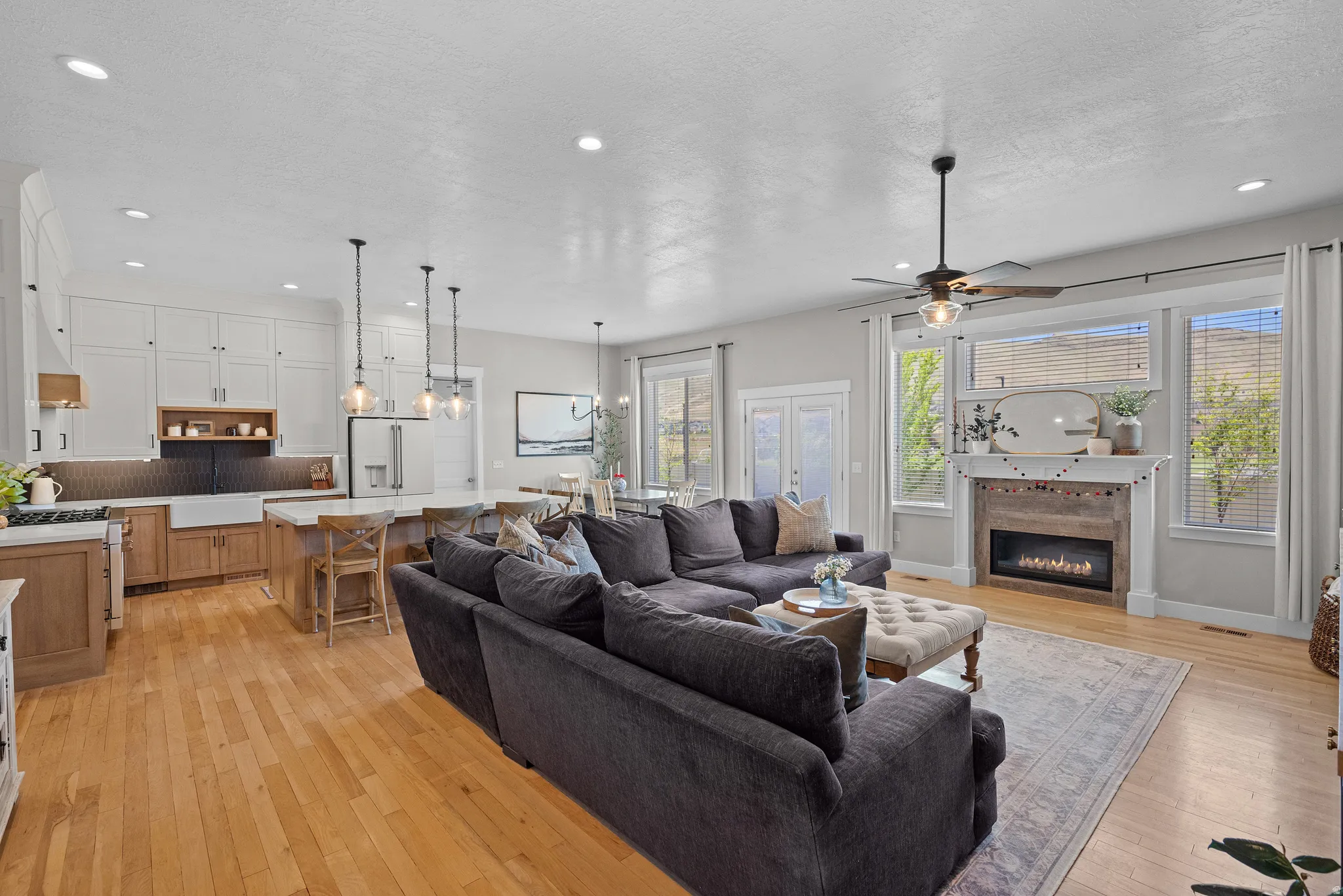 Open-concept living area featuring wood-finish flooring throughout