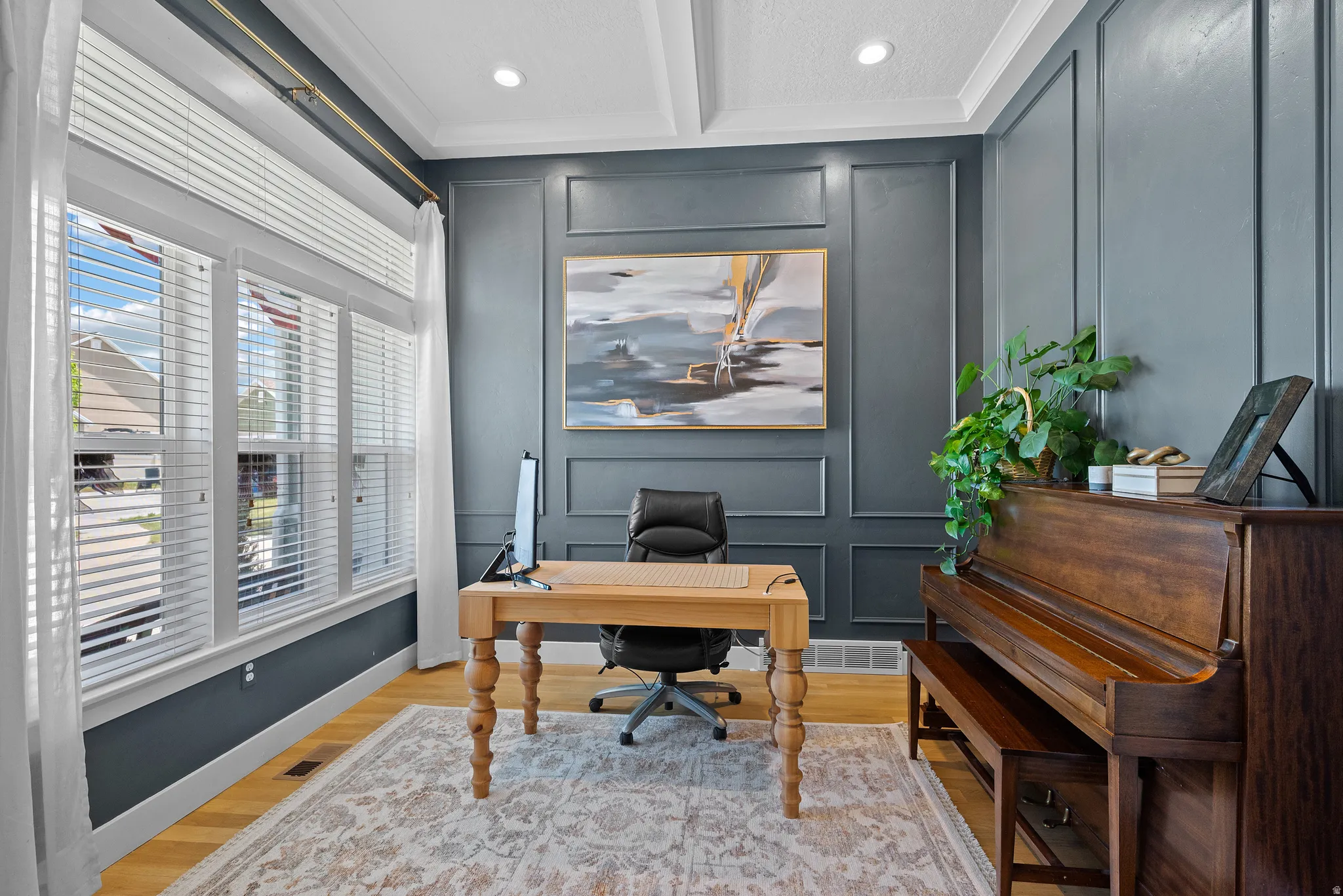Room featuring wainscoting and crown molding, recessed lighting, and light wood-finish flooring