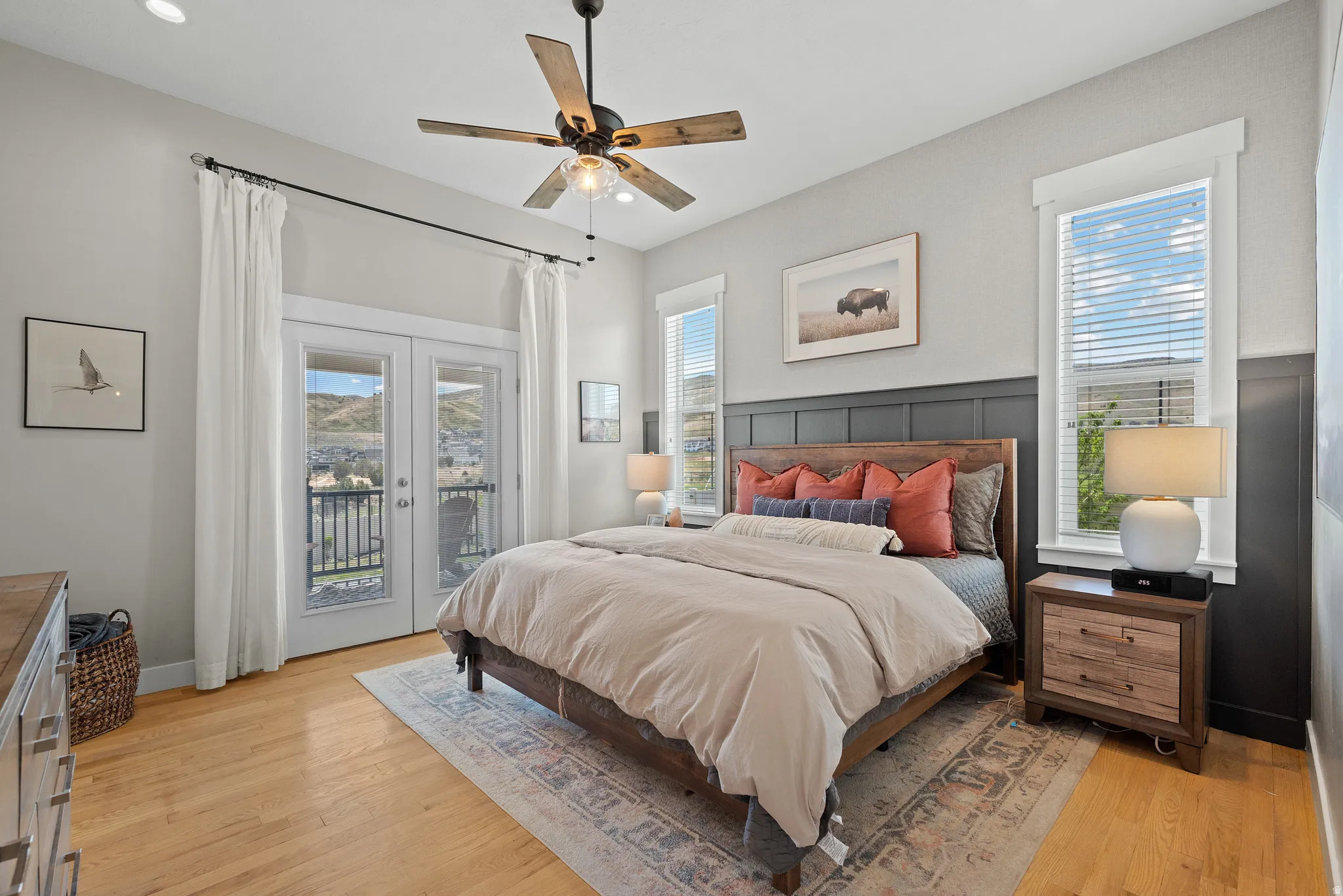 Light wood-finish flooring with a decorative area rug