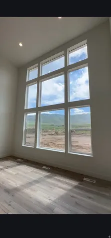 Floor-to-ceiling multi-pane windows showcasing mountain scenery