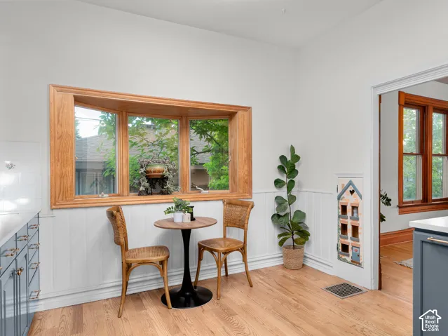 Bright interior space featuring a prominent wood-framed bay window