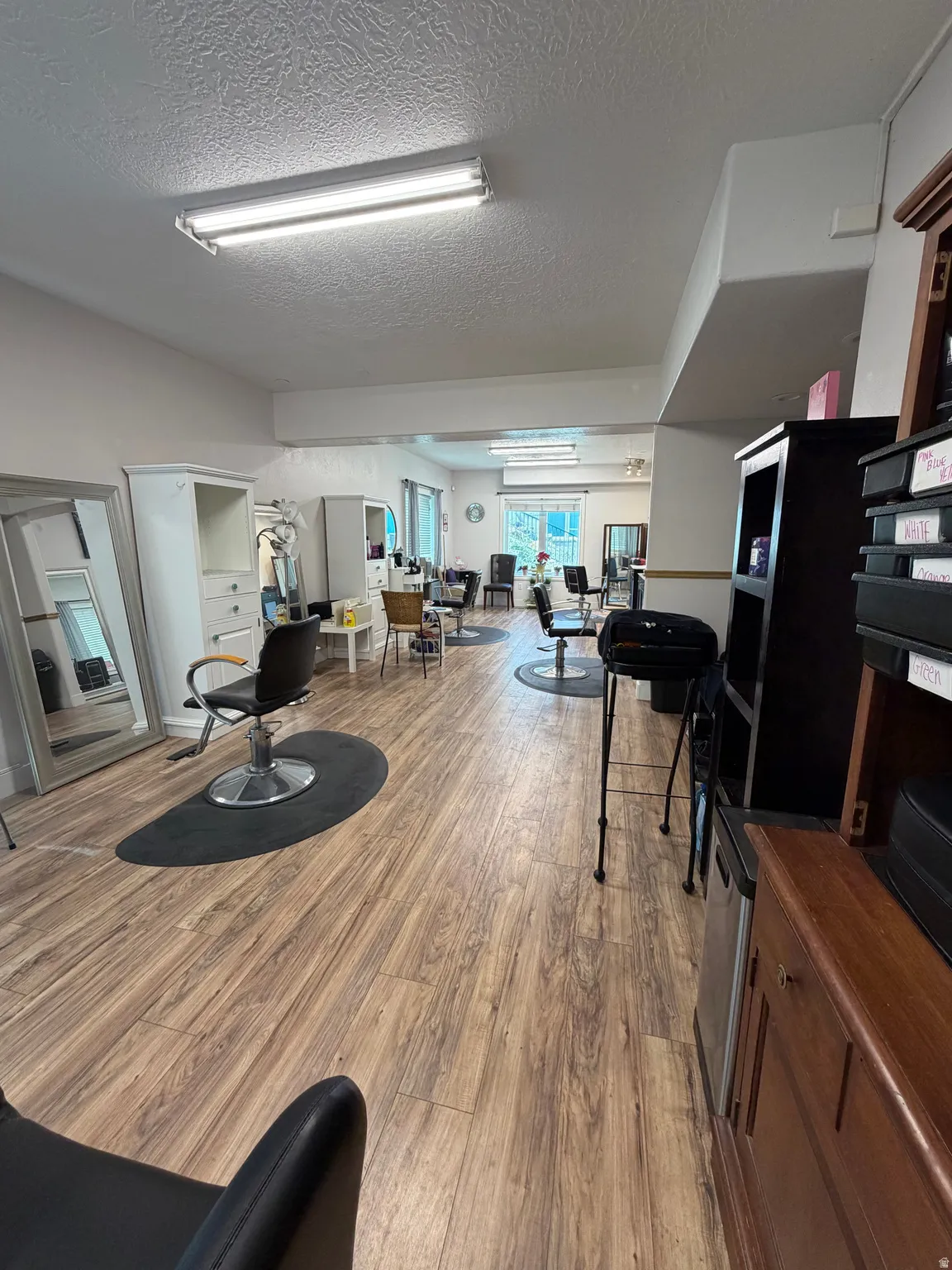 Wood-finish flooring throughout a spacious commercial interior