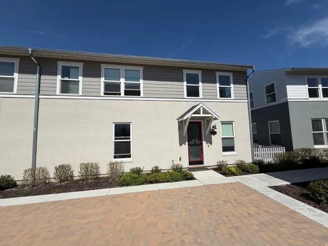 Contemporary facade featuring horizontal siding and stucco finishes