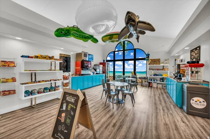 Interior space featuring wood-finish flooring and a vaulted ceiling
