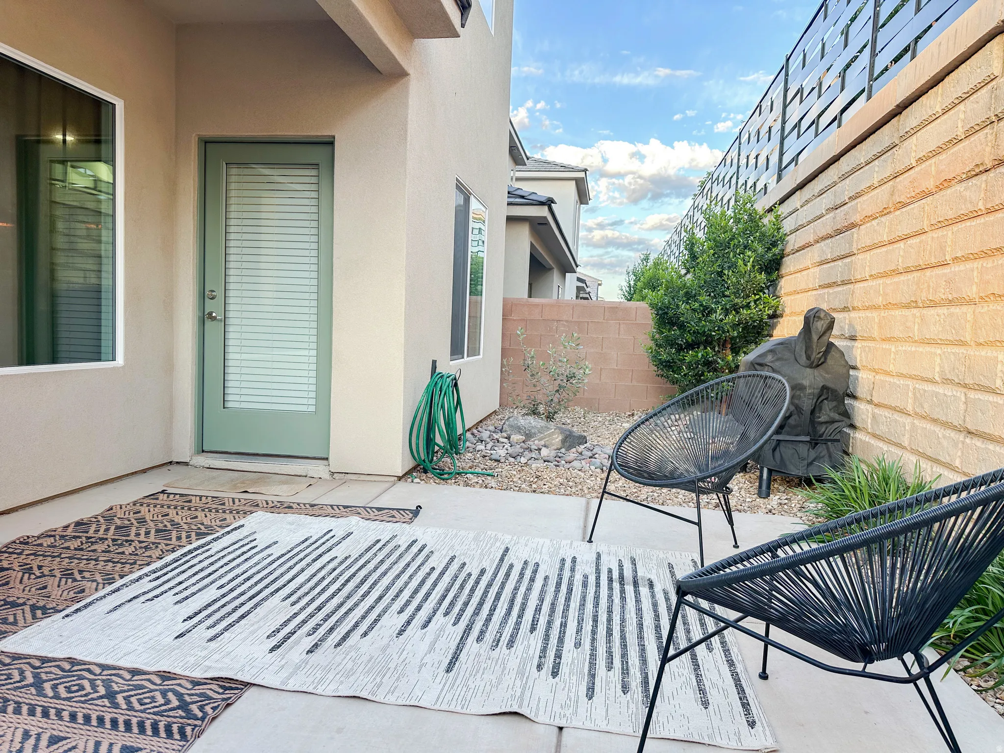 Private patio area featuring a concrete surface