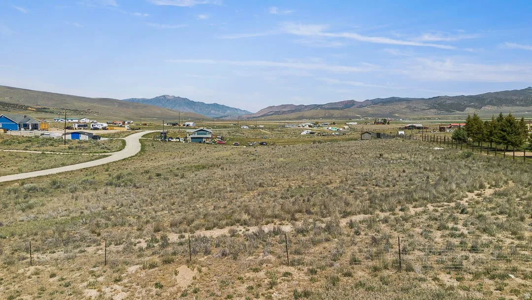 Expansive open acreage featuring a natural landscape and distant mountain scenery