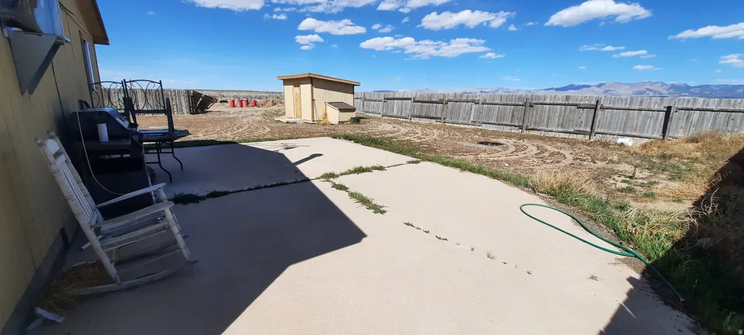 Expansive concrete patio offering a large outdoor living area