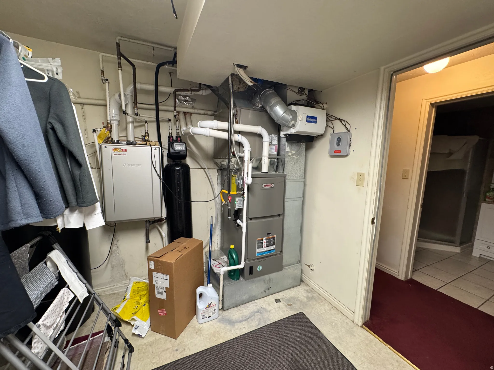 Updated HVAC system with a tankless water heater, water filtration system, and humidifier