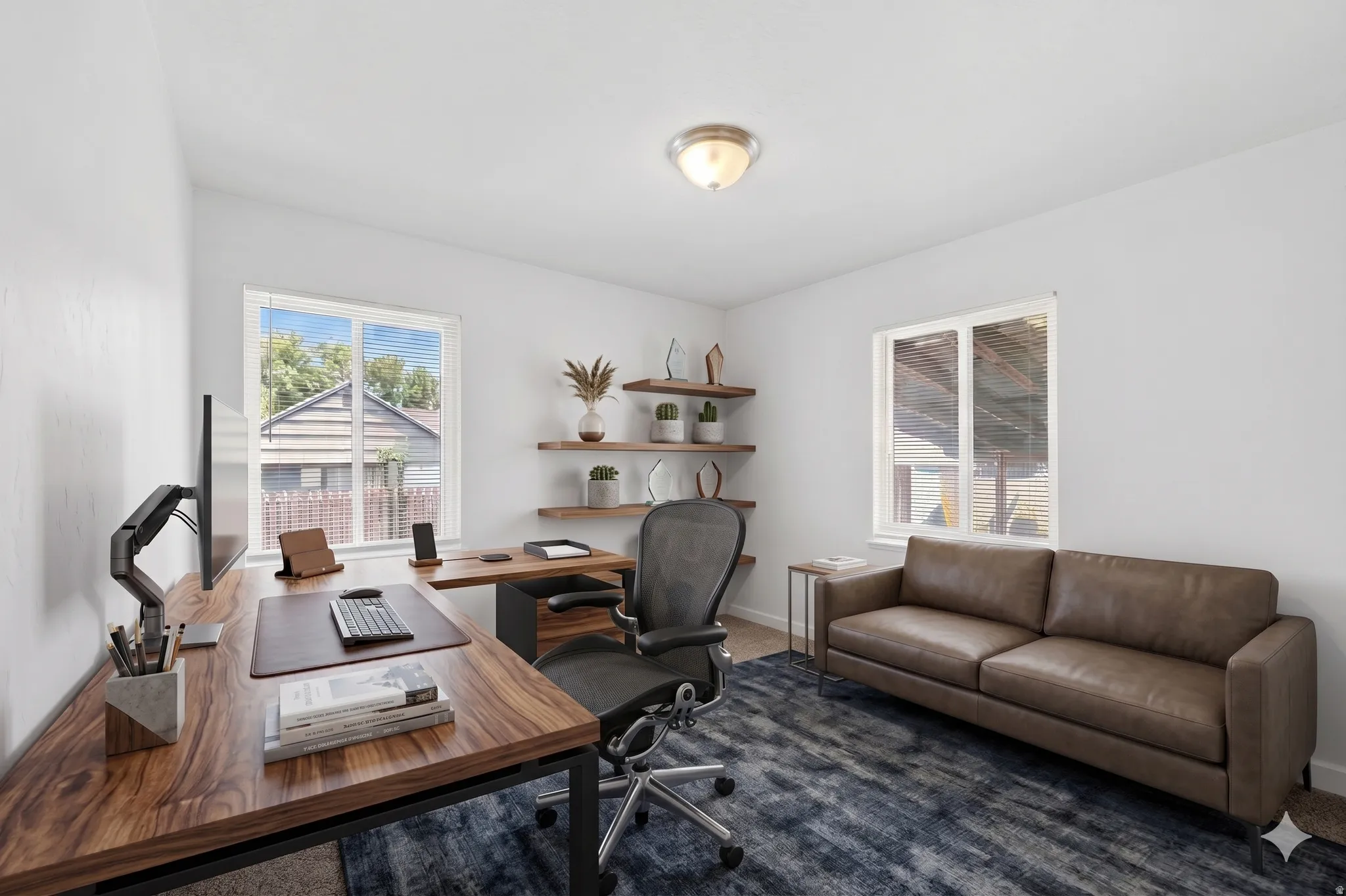 Bright room with white painted walls, two windows, and a flush mount ceiling light