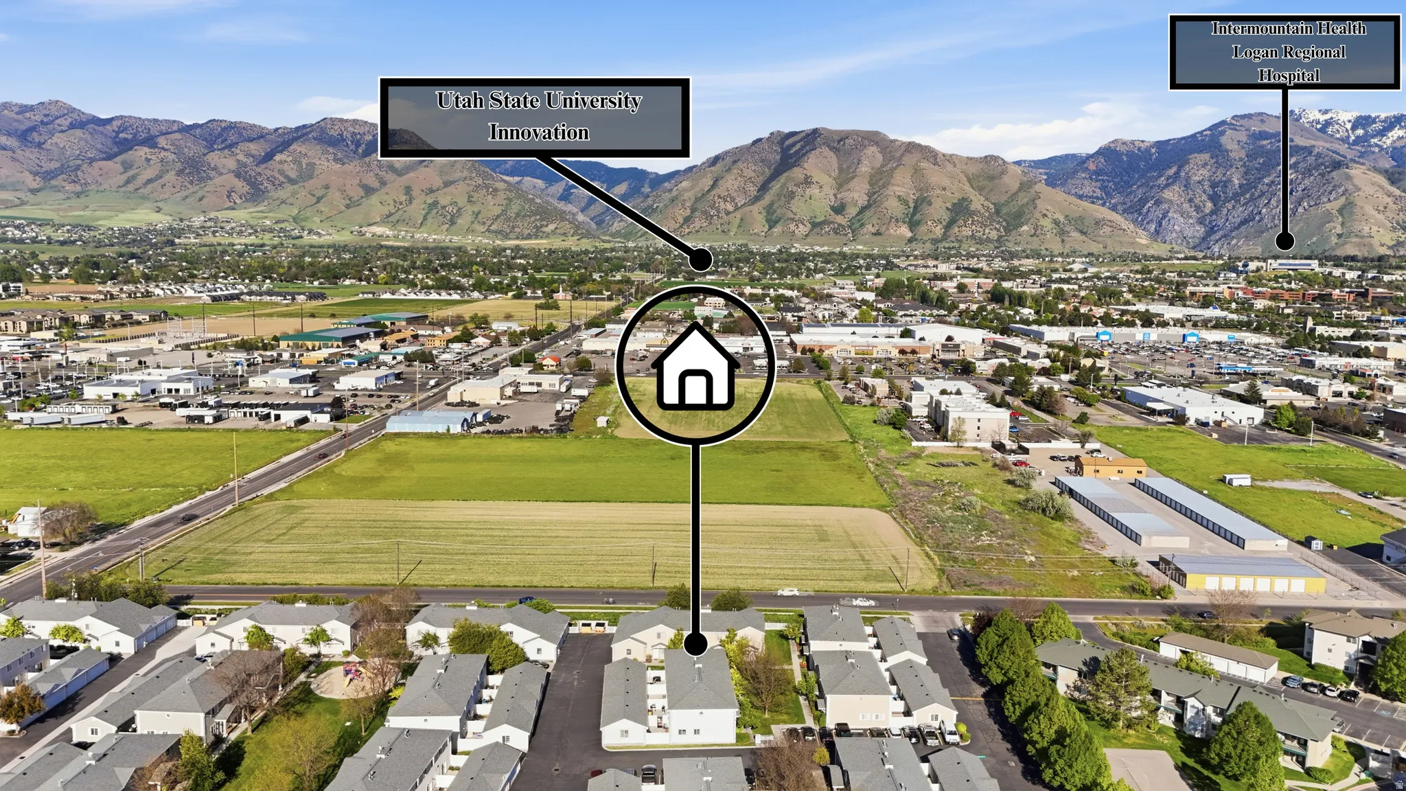Aerial perspective showcasing the property's advantageous placement amidst a developed urban area and expansive green fields
