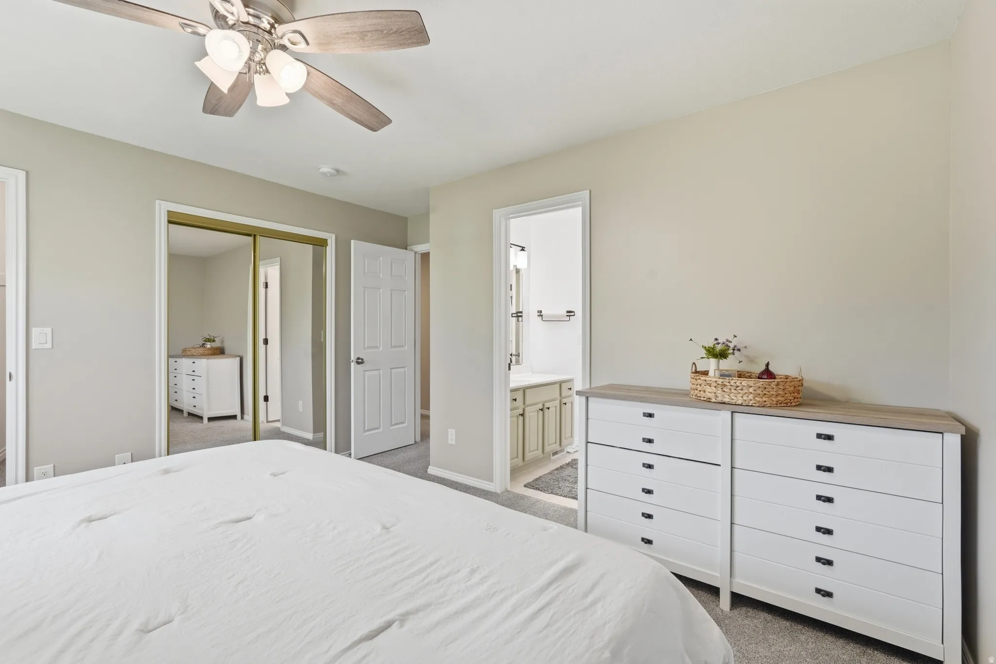Light gray carpeted room with neutral wall tones