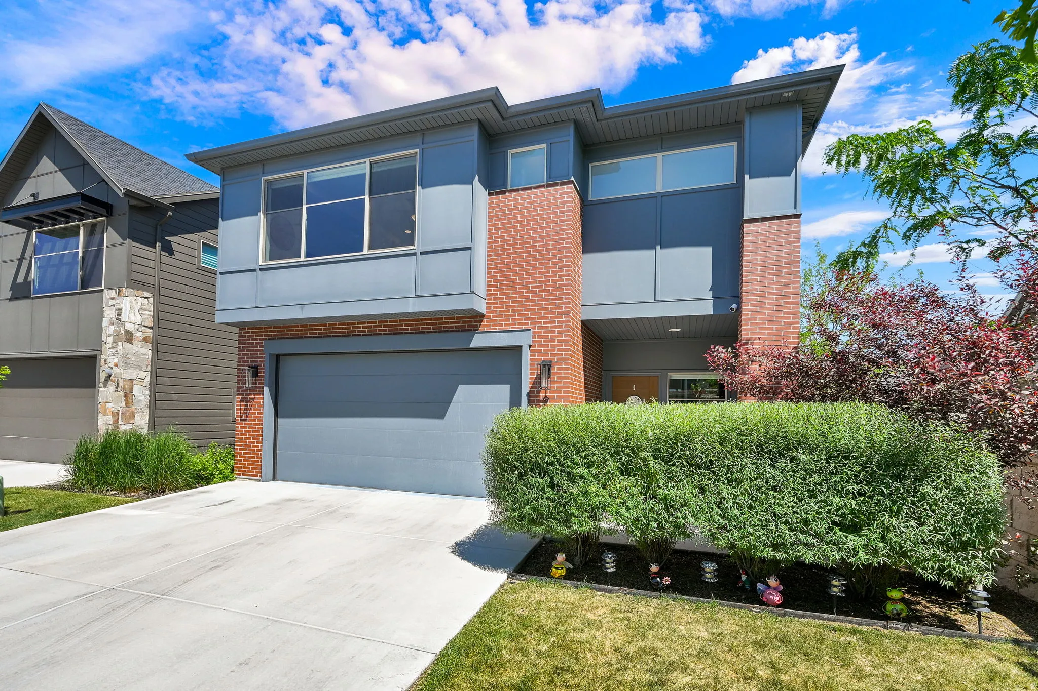 Modern architecture featuring a grey facade with brick accents