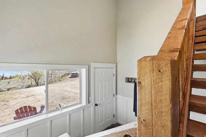 Wood-finish staircase with a substantial newel post