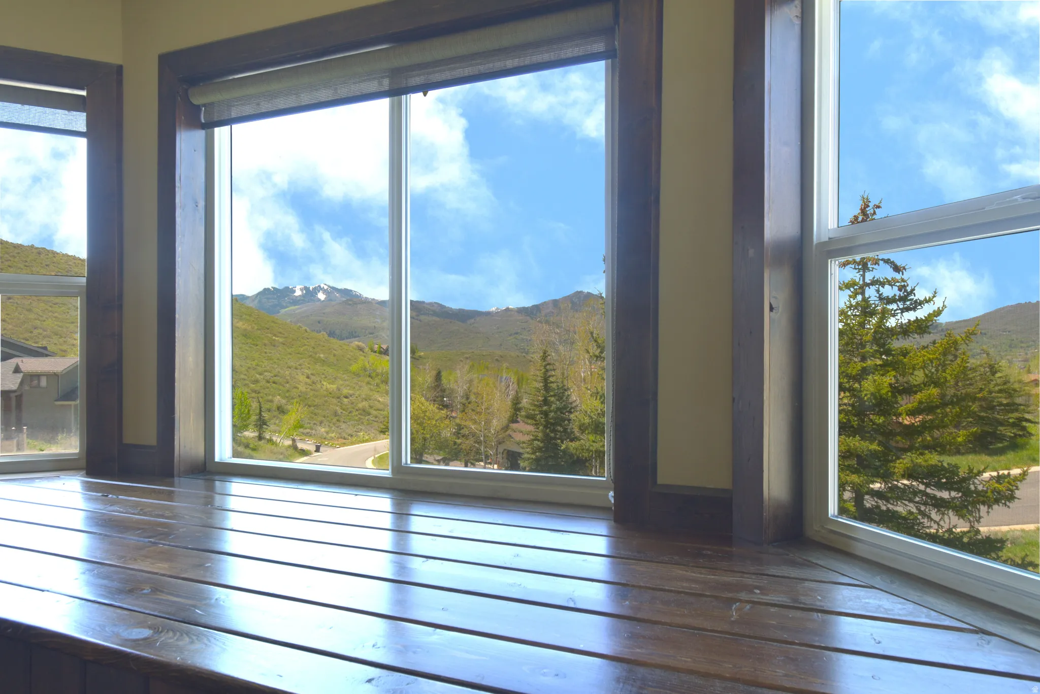 Window bay featuring a built-in wood-finish bench