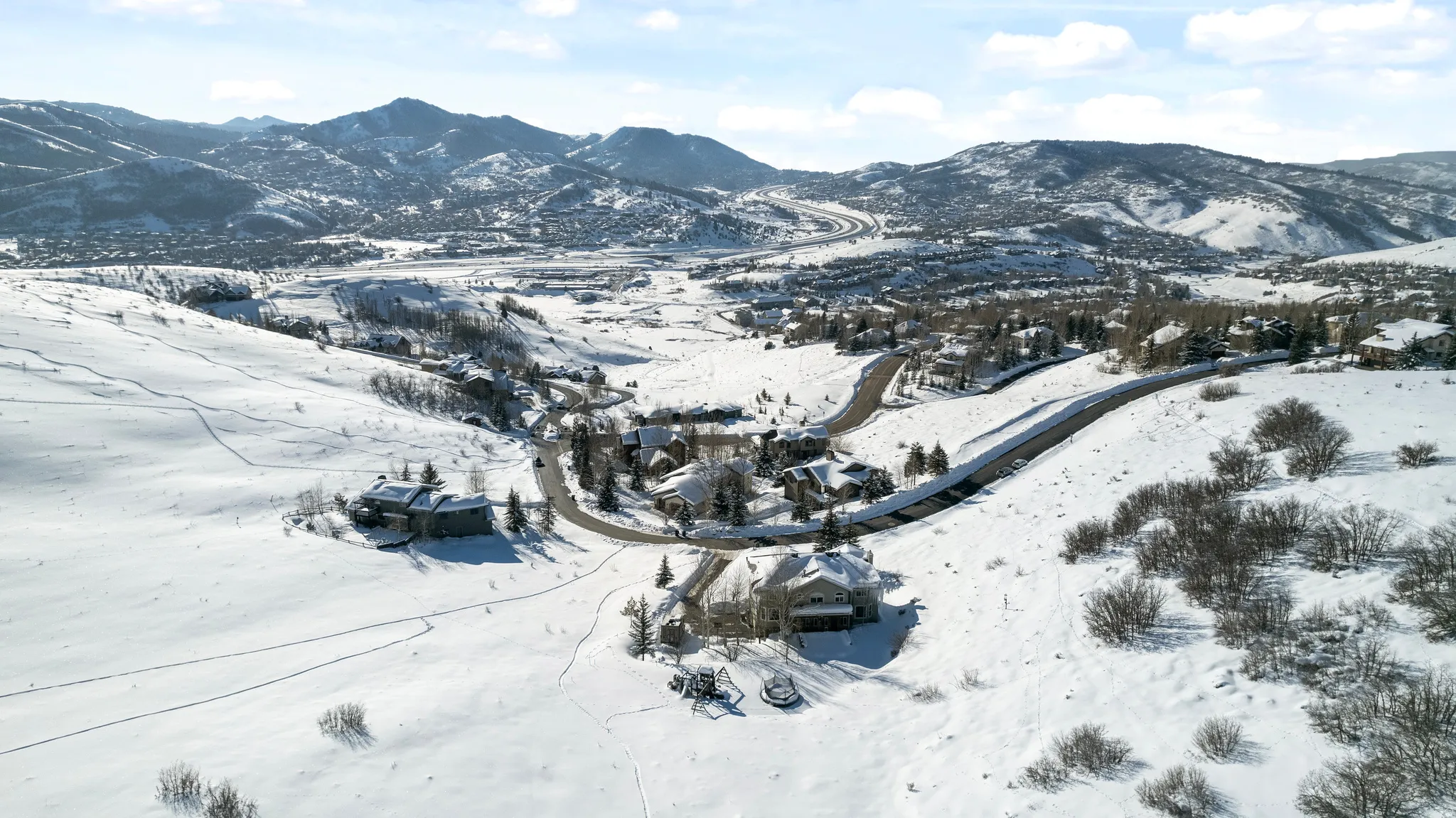 Snow-covered landscape with distant mountains