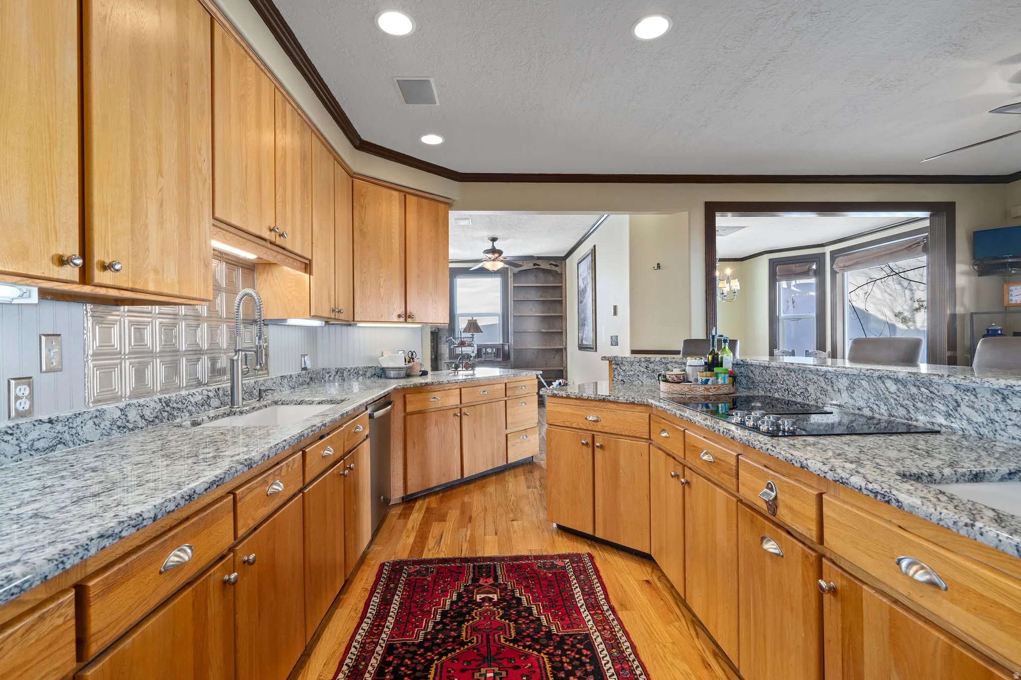Kitchen featuring light wood cabinetry and granite countertops