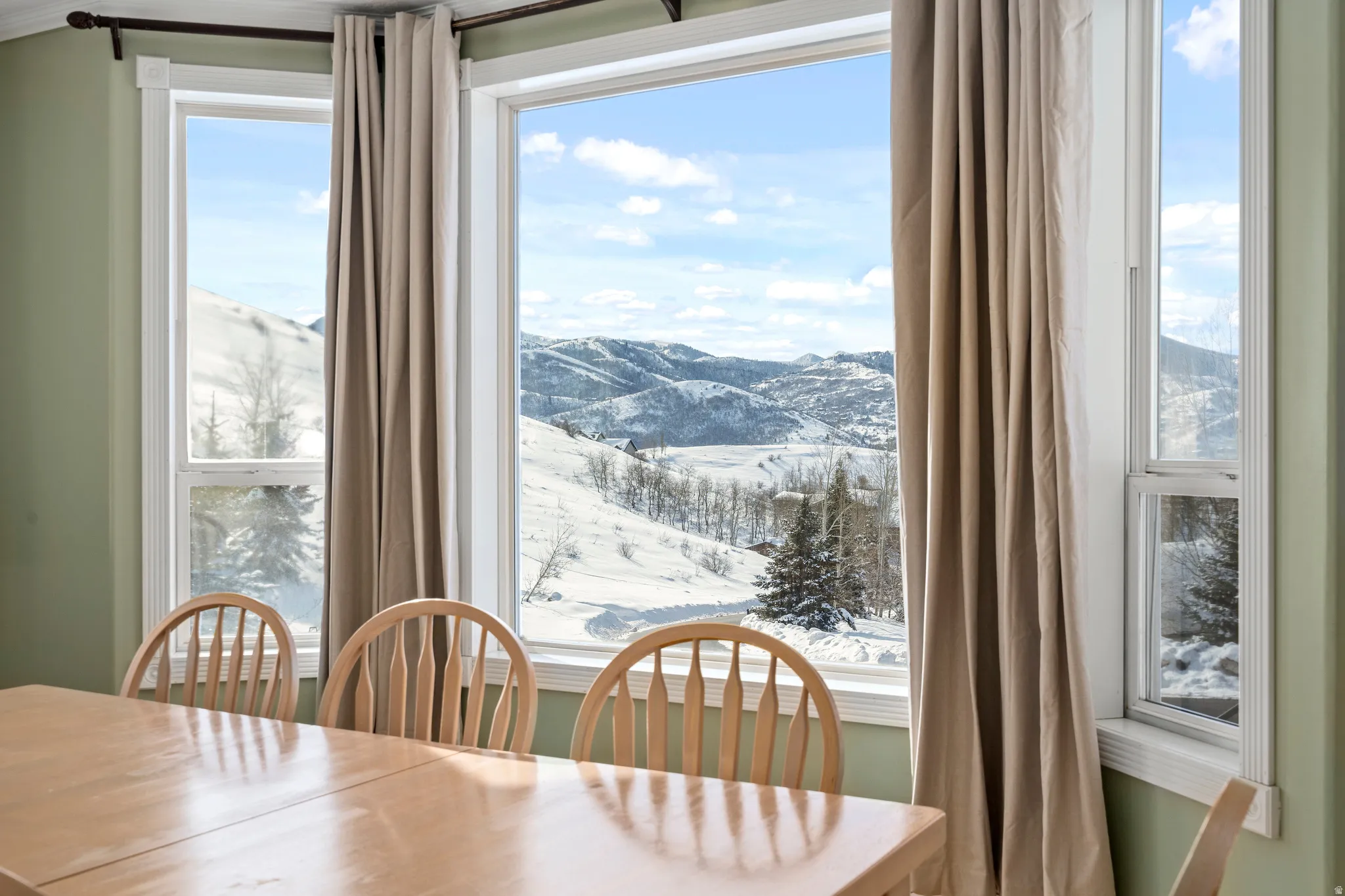 Expansive window wall with mountain scenery