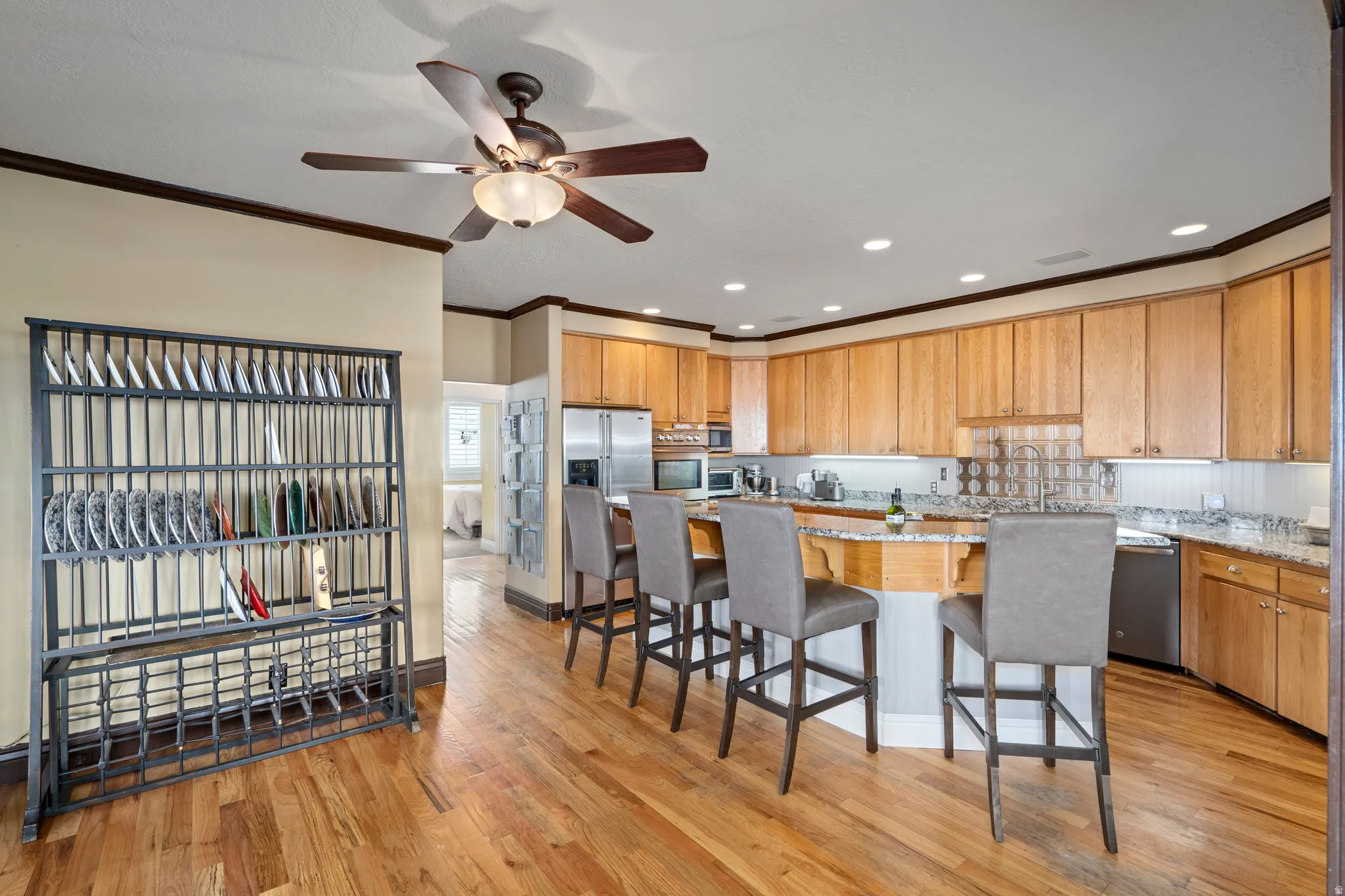 Kitchen featuring wood-finish flooring, recessed lighting, and a ceiling fan