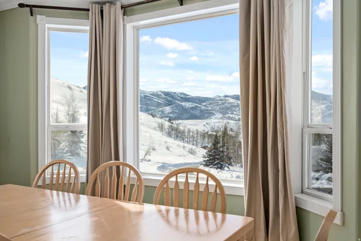 Expansive window wall with mountain scenery