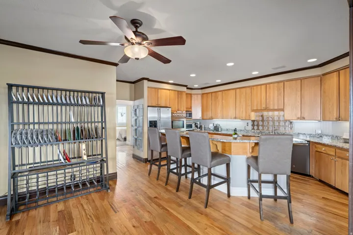 Kitchen featuring wood-finish flooring, recessed lighting, and a ceiling fan