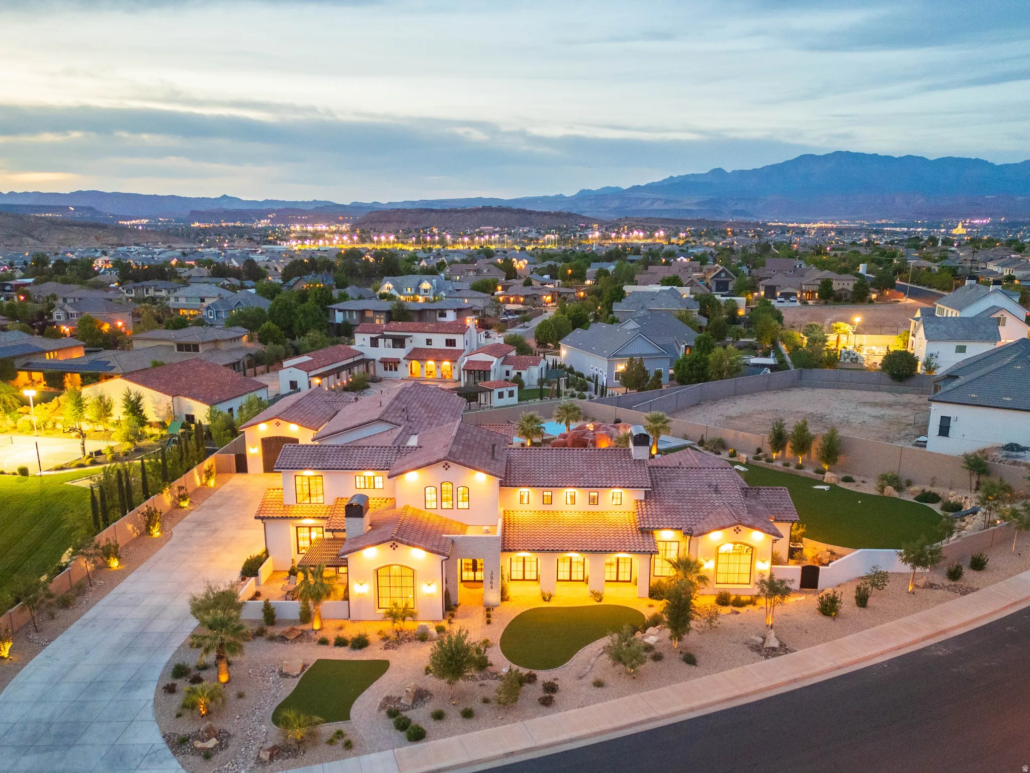 Aerial perspective of suburban area featuring a mountain backdrop