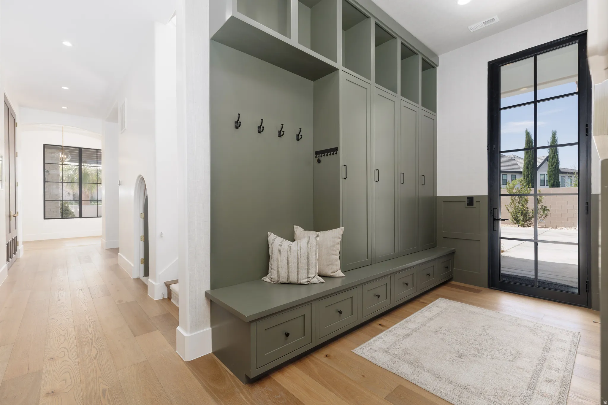 Mudroom featuring light wood-type flooring and recessed lighting
