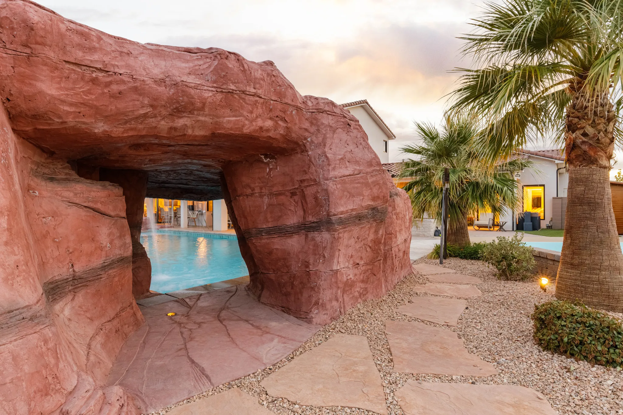 Pool at dusk featuring an outdoor pool