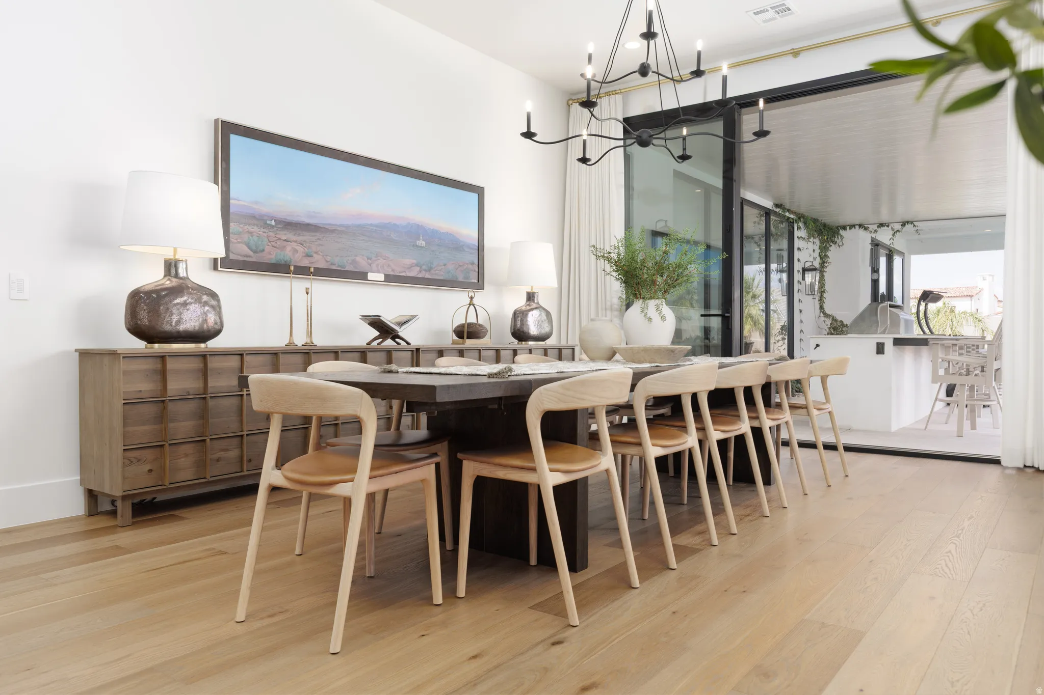 Dining space featuring light wood-style floors and hanging lights