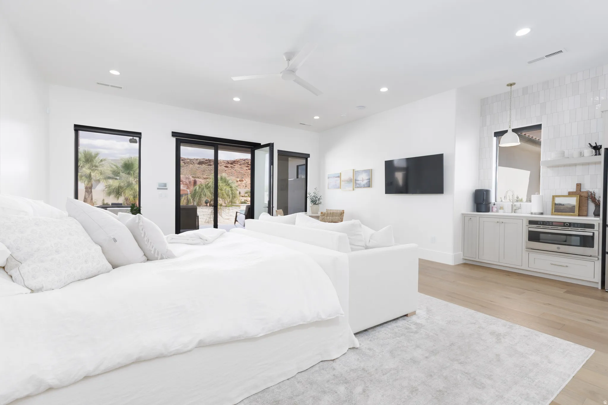 Bedroom with light wood-style flooring, access to exterior, recessed lighting, and a ceiling fan