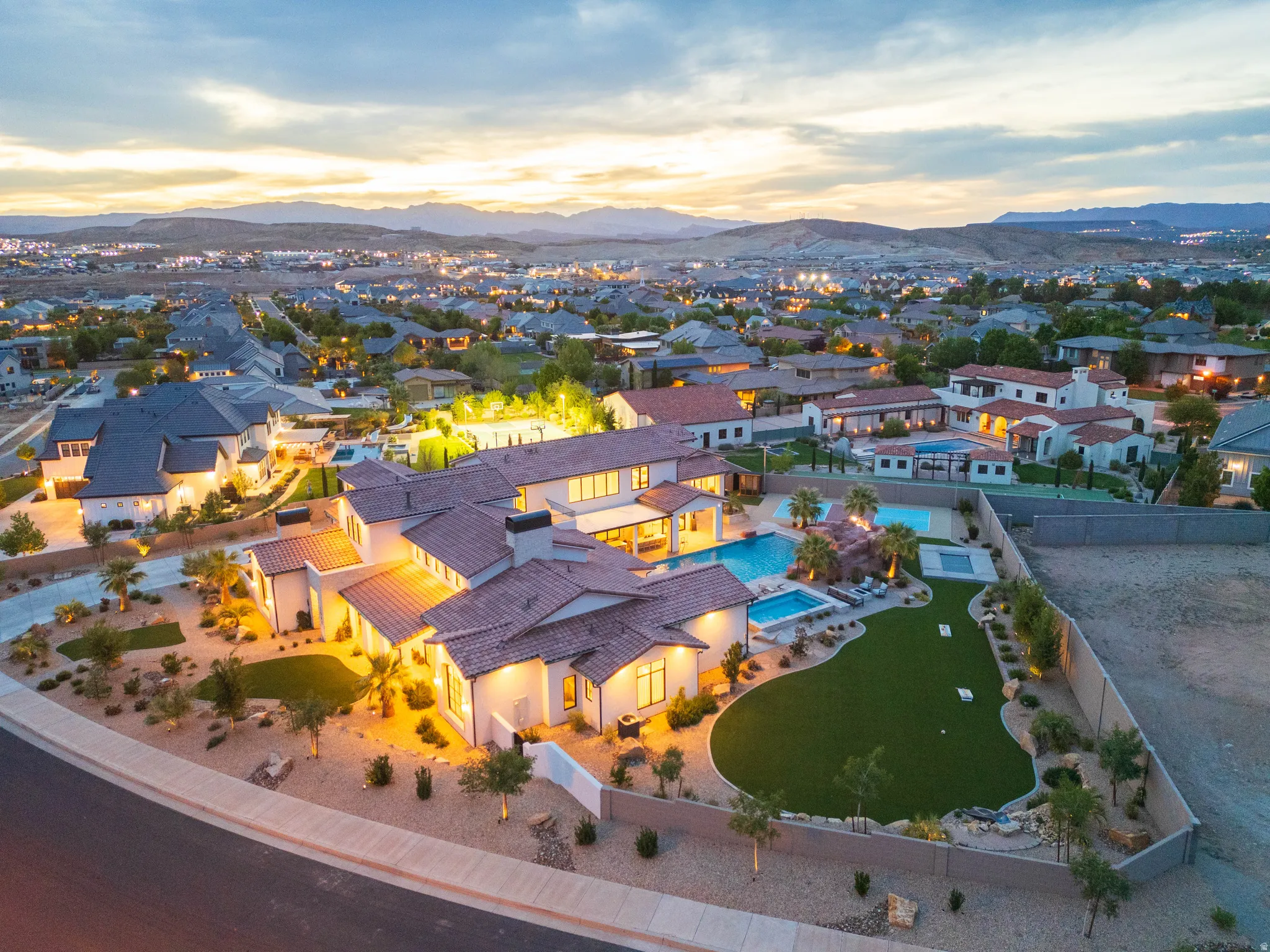 Aerial view of residential area featuring a mountain backdrop