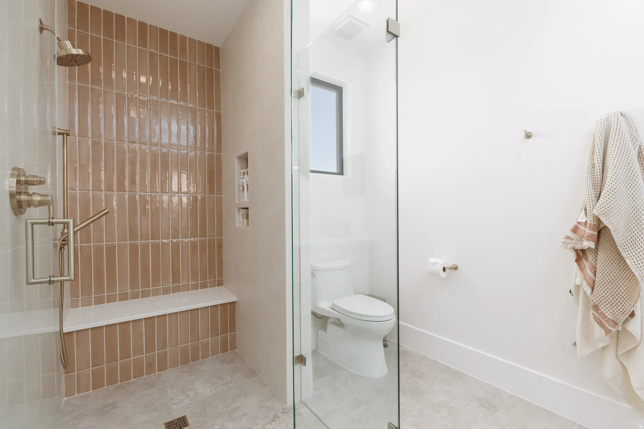 Full bathroom with a stall shower and light tile patterned flooring
