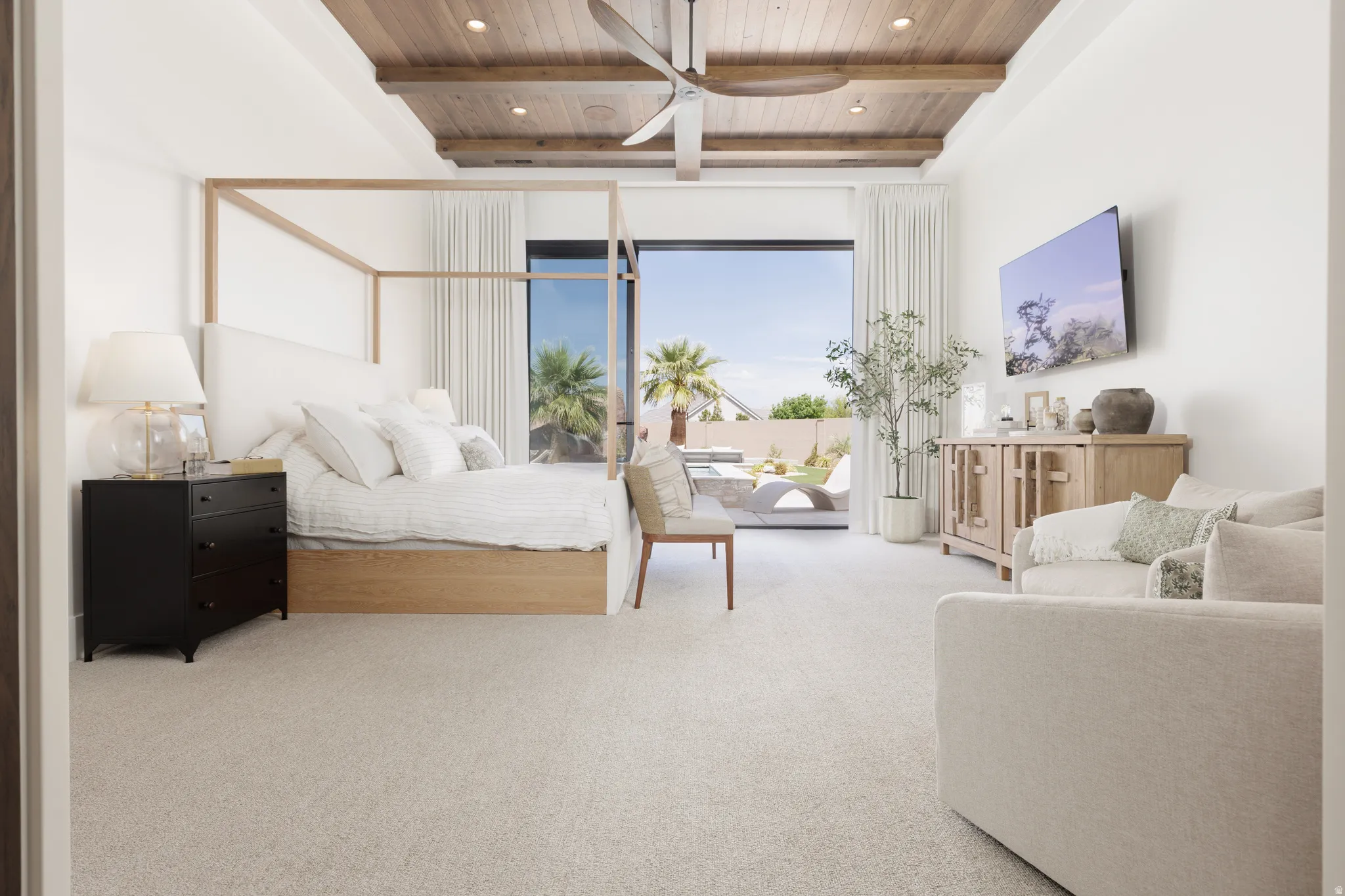 Bedroom featuring a wooden ceiling with exposed beams, light colored carpet, access to exterior, and recessed lighting