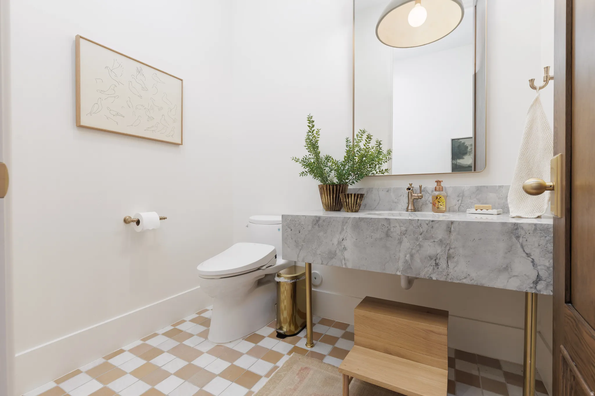 Half bathroom featuring vanity and toilet