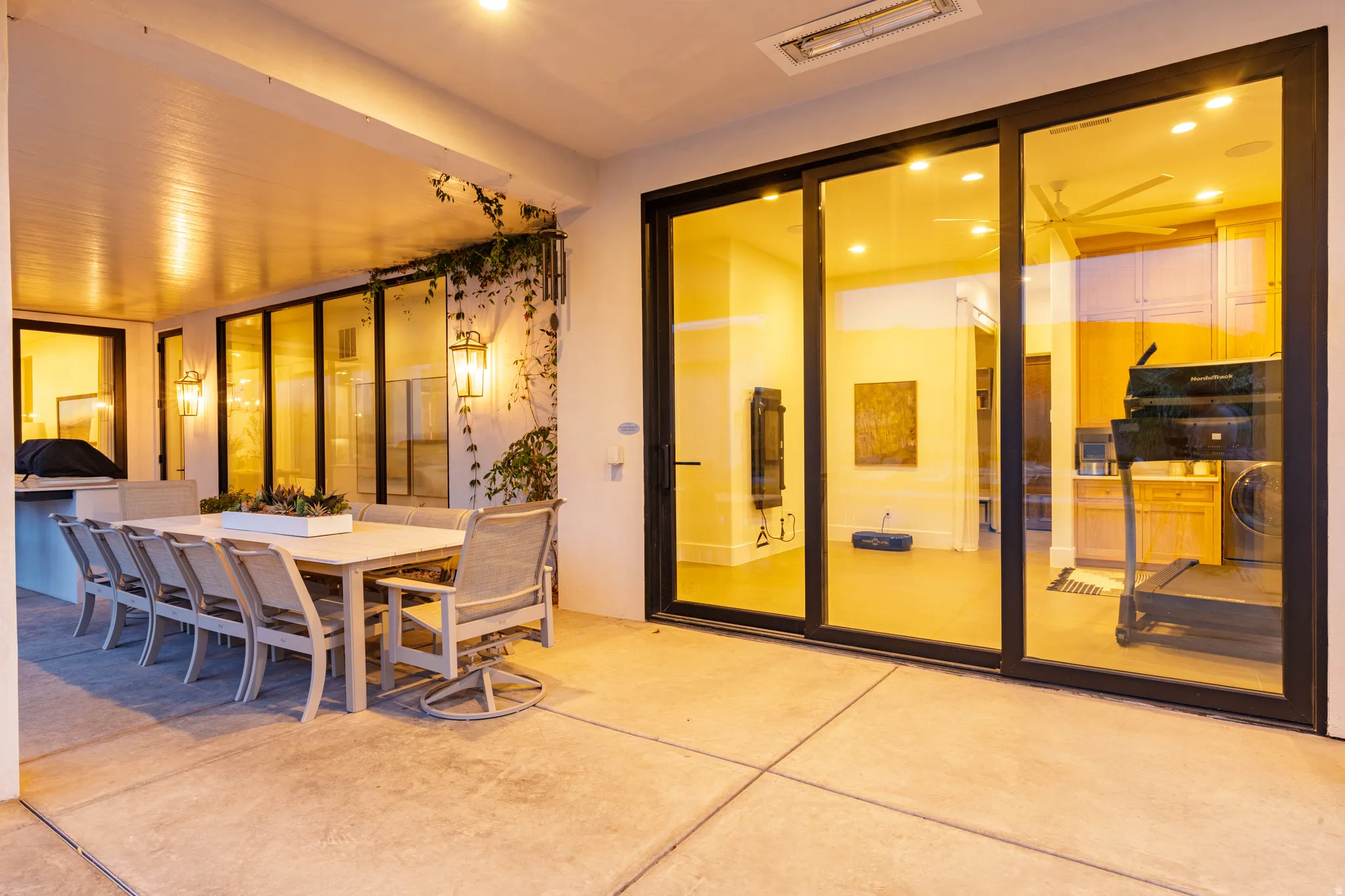 View of patio / terrace featuring washer / dryer and an outdoor kitchen / dining area