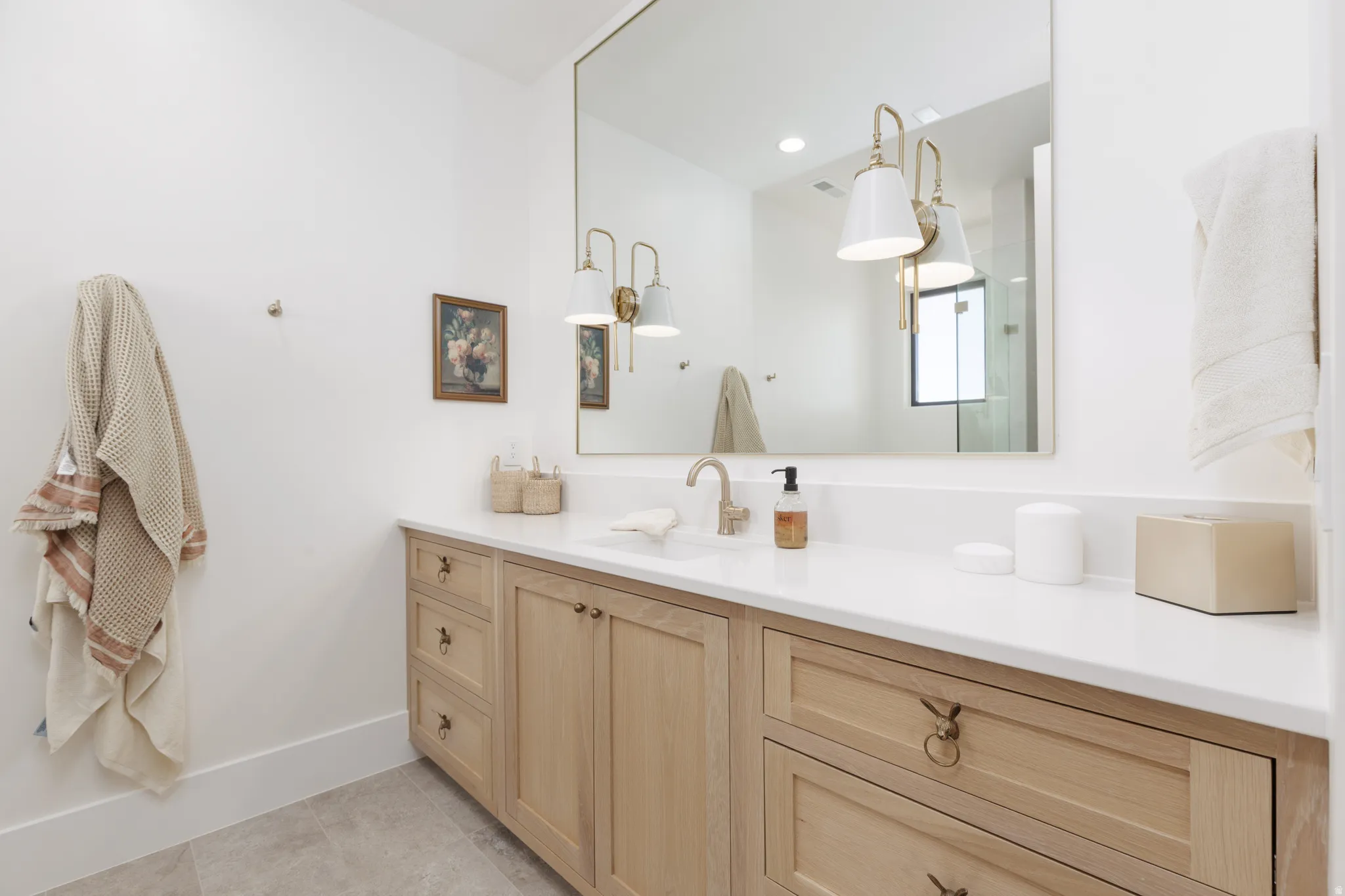 Bathroom with vanity and light tile patterned floors