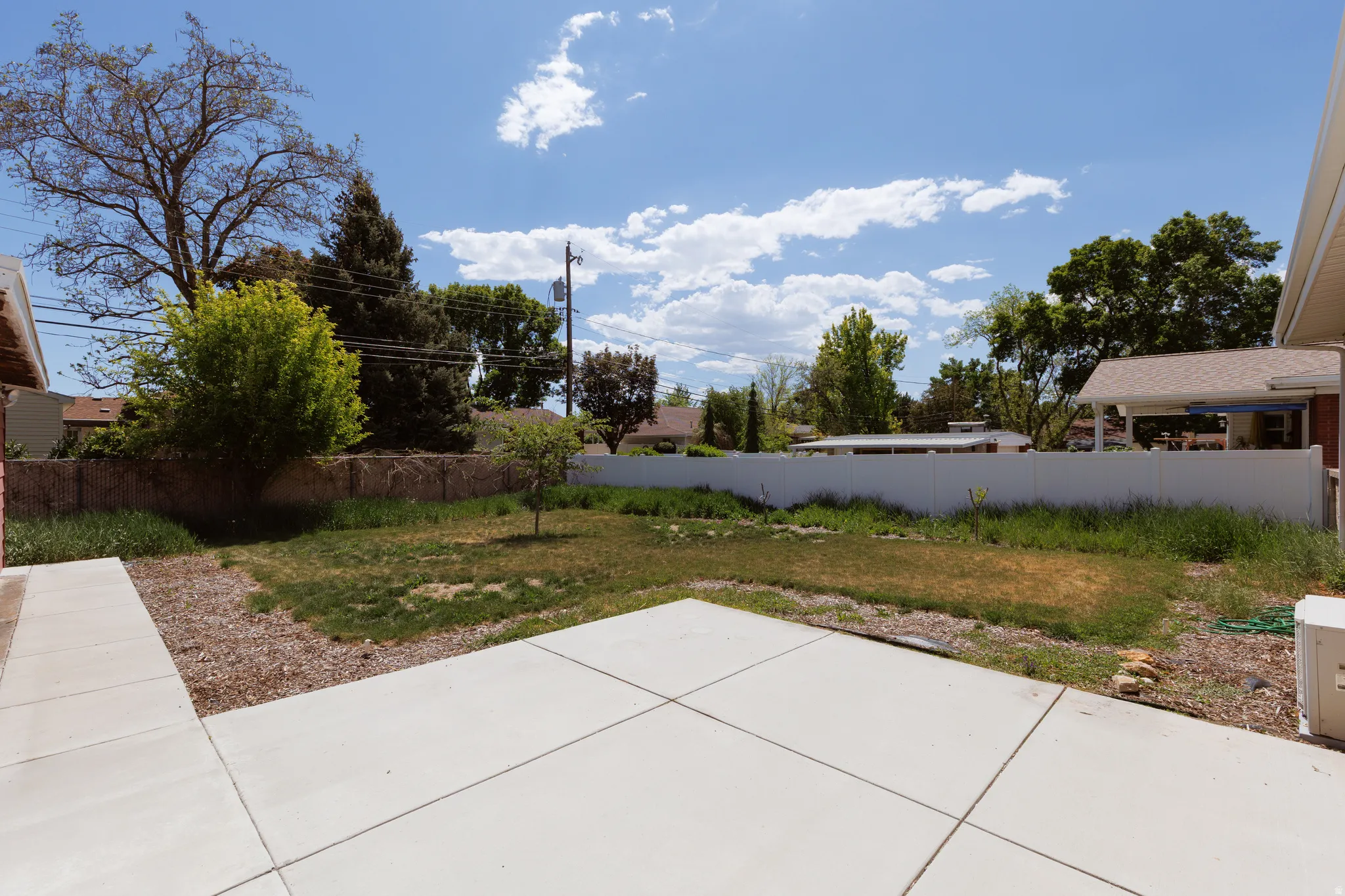 Expansive concrete patio with integrated walkways