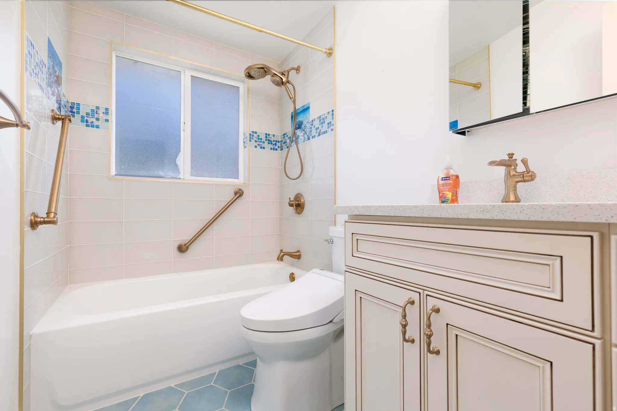 Bathroom featuring a white vanity with recessed panel cabinet doors, a speckled countertop, and a single-handle faucet