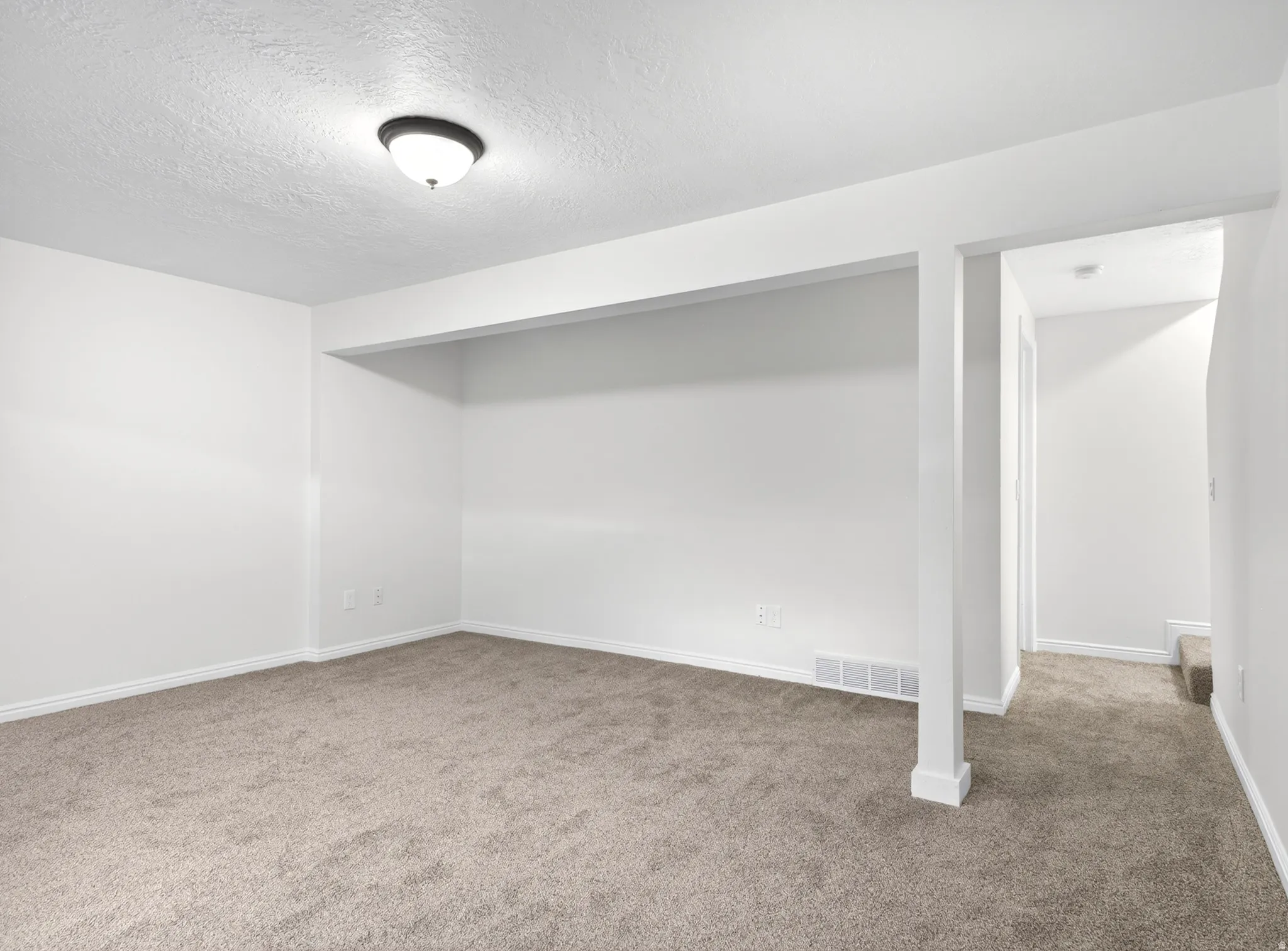 Family room and hallway in basement