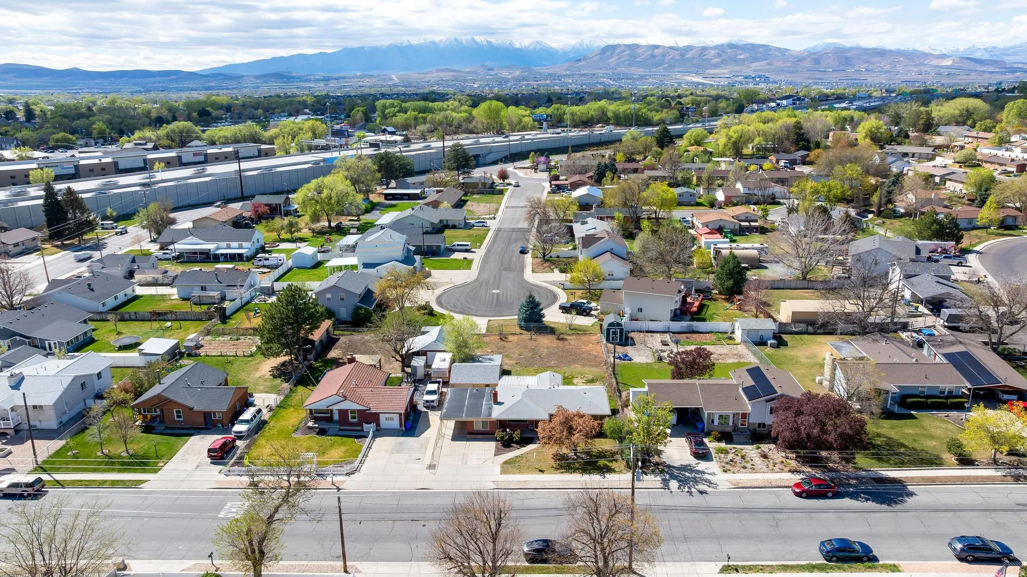 Aerial view of residential area with a mountainous background