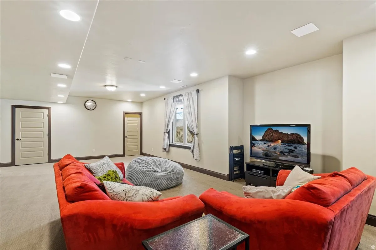 Spacious room featuring recessed lighting, light-toned walls, and wood-trim details