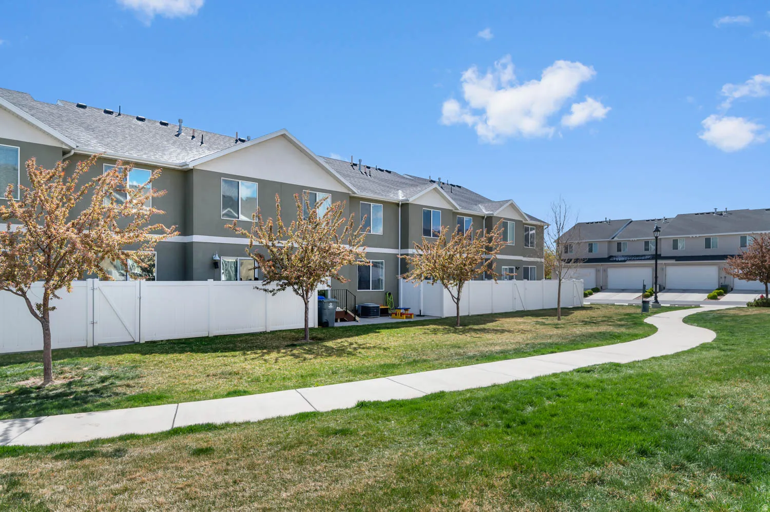 Expansive green space with a winding paved path