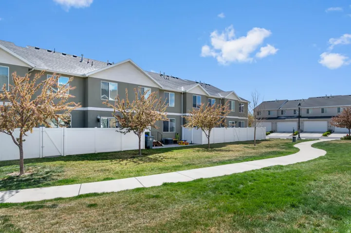 Expansive green space with a winding paved path