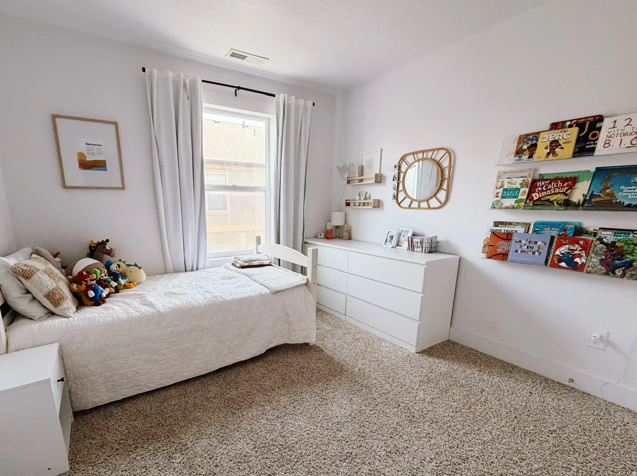 Bedroom 3 featuring neutral carpeting and white walls