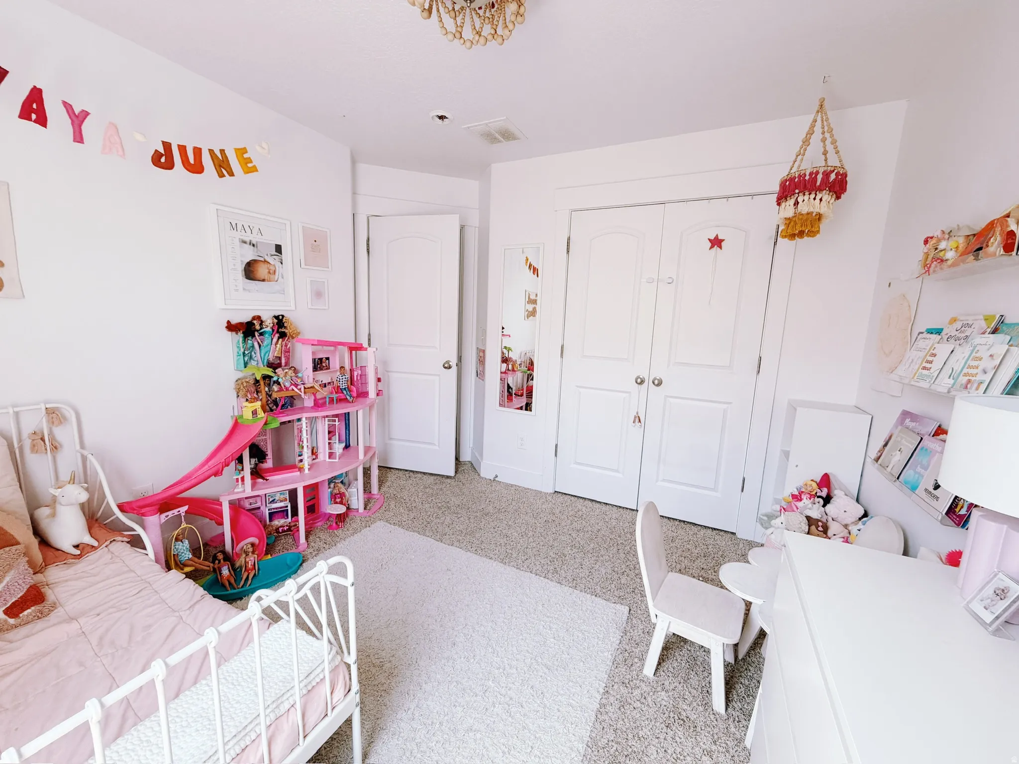 Bedroom 2 - Neutral wall color, carpeted flooring, and a decorative ceiling fixture