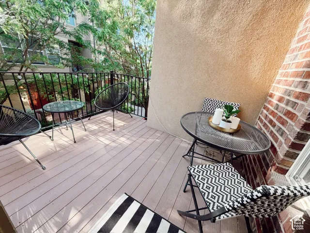Outdoor balcony featuring wood-finish decking