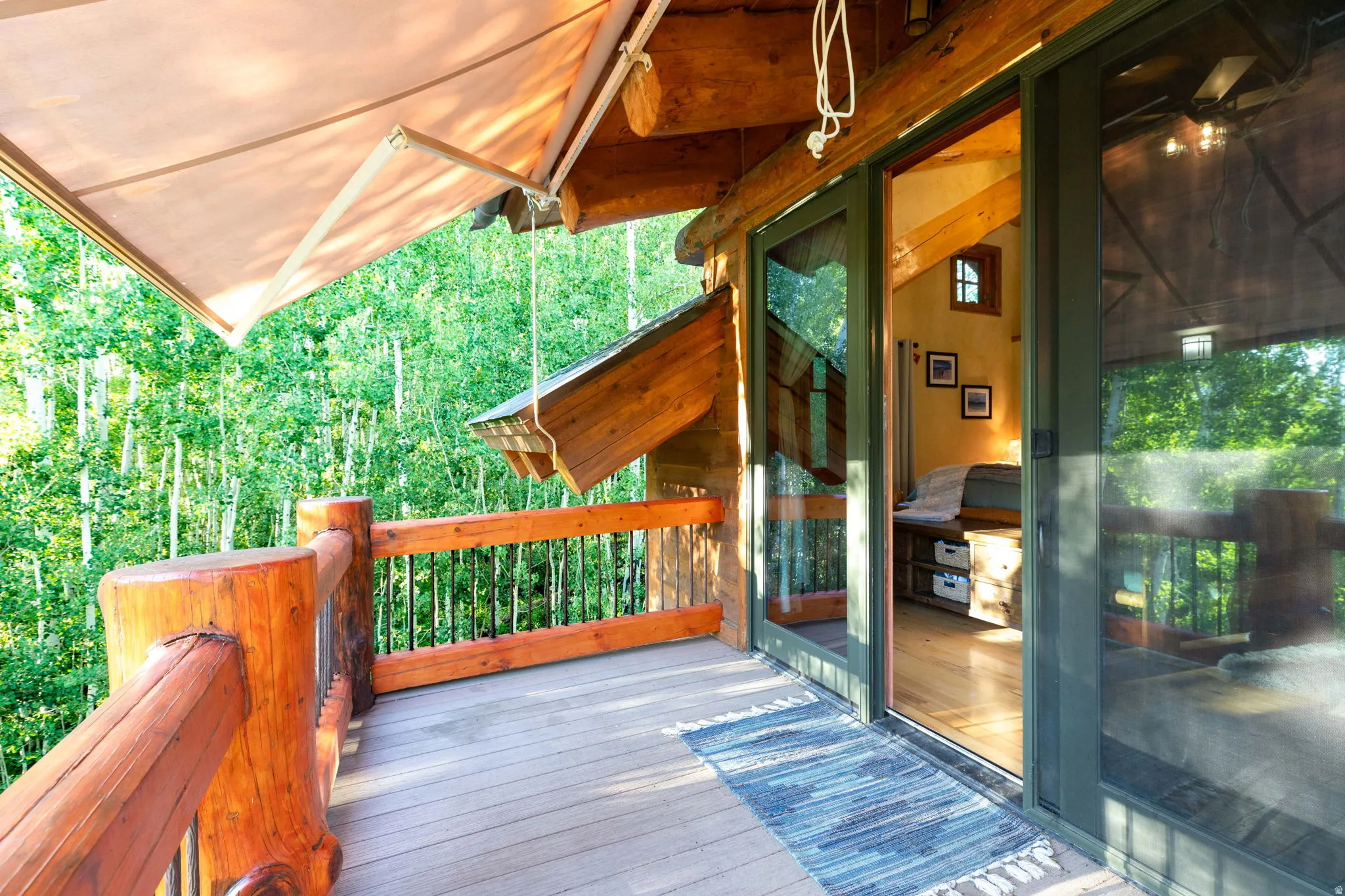 Outdoor deck with wood-finish decking and natural wood railings