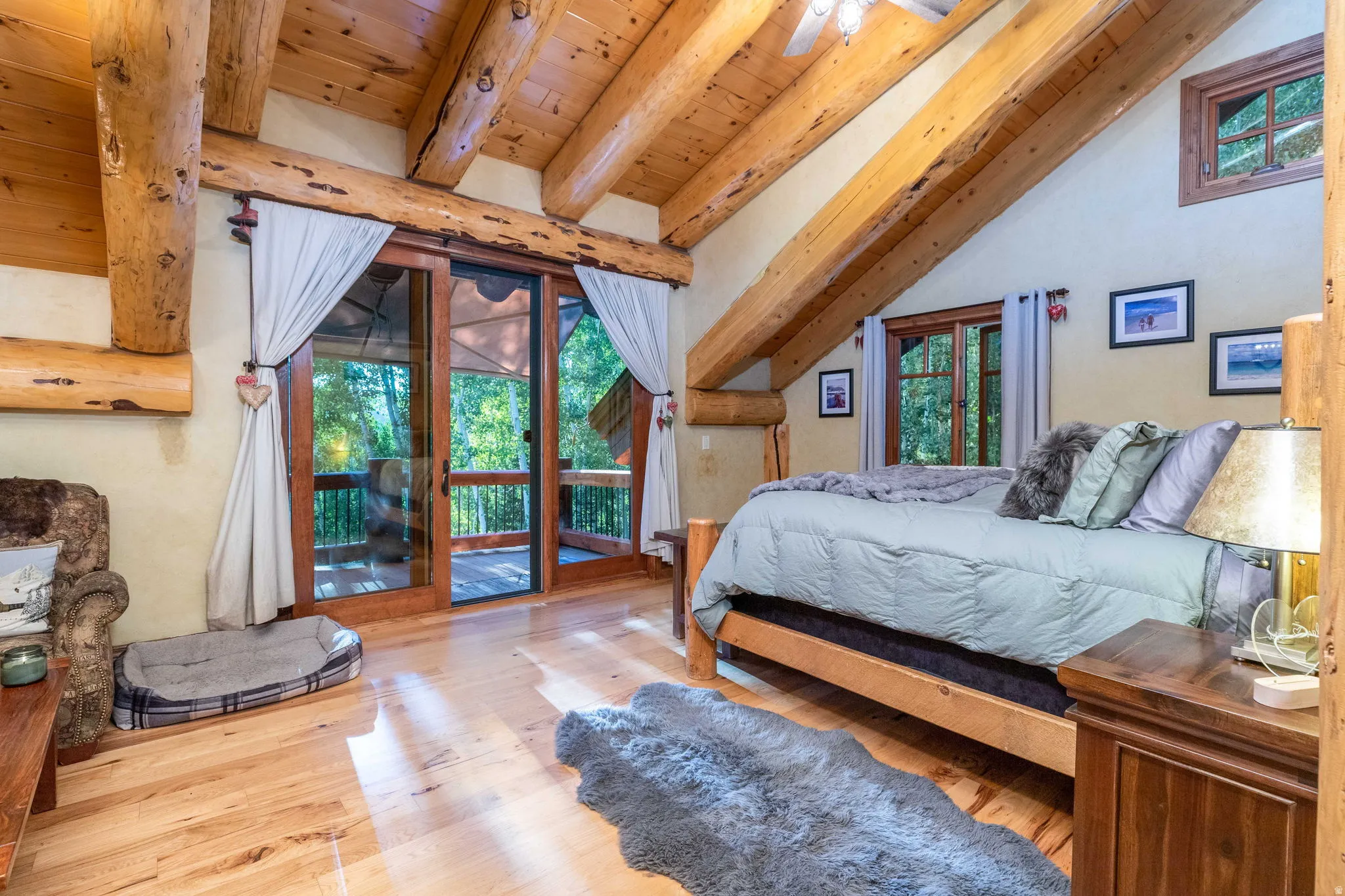 Interior space featuring exposed wood beams and wood-finish flooring