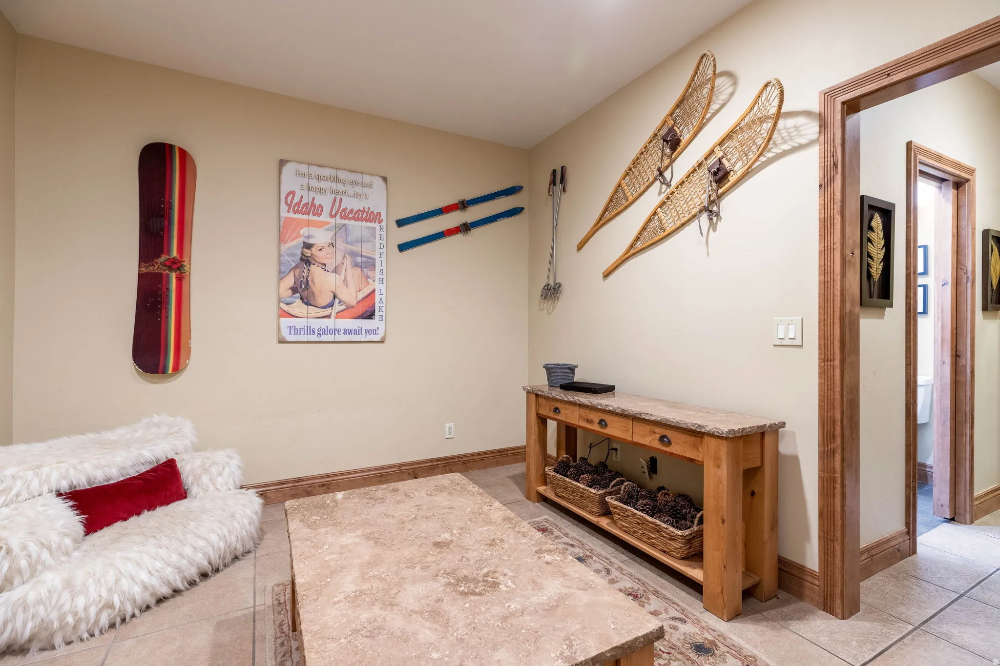 Recessed lighting illuminates neutral walls and tile flooring
